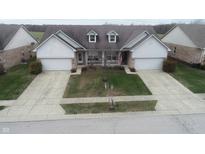 Attractive twin home with two-car garage and landscaped lawn at 316 Society Dr, Indianapolis, IN 46229