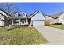 Charming single-Gathering home with a well-manicured lawn and a welcoming front porch at 316 Society Dr, Indianapolis, IN 46229