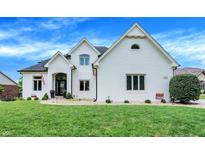Stunning white brick home with a beautifully landscaped lawn at 3828 Highland Park Dr, Greenwood, IN 46143