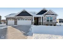 Two-story house with gray siding, white garage doors, and a snow-covered front yard at 2364 Eagle Ave, Plainfield, IN 46168