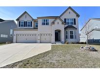 Charming two-story home with a three car garage and well-manicured front lawn at 4061 Omaha Dr, Bargersville, IN 46106