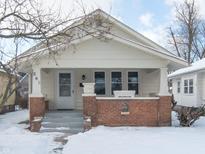 Charming craftsman home with brick details and a covered porch at 262 N Tremont St, Indianapolis, IN 46222