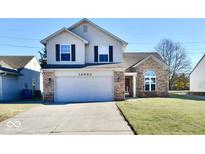 Two-story house with attached garage and well-maintained lawn at 12983 Wingstem Ct, Fishers, IN 46038