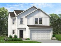 Charming two-story home boasts white siding, a dark roof, an attached two-car garage and a professionally landscaped yard at 2005 Oak Leaf Way, Shelbyville, IN 46176