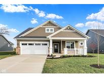 New single-story home with a two-car garage and front porch at 7159 Rose Hill Ave, Brownsburg, IN 46112