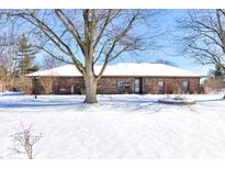 Brick ranch home with snow covered yard at 6932 W Jennifer Ln, Greenfield, IN 46140