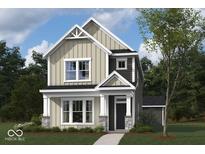 Two-story house with beige and gray siding, stone accents, and a front porch at 1717 Real St, Indianapolis, IN 46240