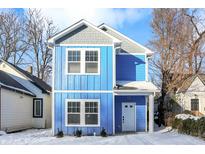 Two-story blue house with gray accents, white trim, and a light gray roof at 2136 Sugar Grove Ave, Indianapolis, IN 46202