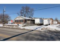 Commercial building with parking lot and snow-covered ground at 3324 Prospect St, Indianapolis, IN 46203