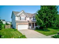 Charming two-story home featuring a two-car garage and well-manicured front lawn at 3460 Limelight Ln, Whitestown, IN 46075