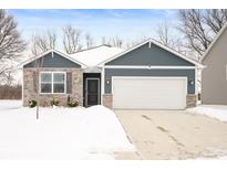 Newly built home with gray siding, stone accents, and a two-car garage at 829 Stark St, Greenfield, IN 46140