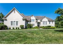 Large two-story house with light-colored brick and landscaping at 8526 Oakmont Ln, Indianapolis, IN 46260