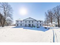 Stunning two-story home with a snow covered front yard at 881 E 226Th St, Sheridan, IN 46069