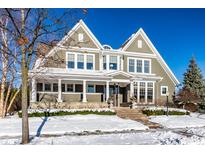 Two-story house with white columns, stone accents, and snowy landscaping at 13232 Broad St, Carmel, IN 46032