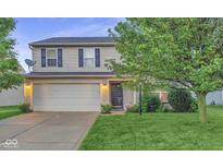 Two-story house with attached garage and well-maintained lawn at 3721 Rinehall Dr, Indianapolis, IN 46235