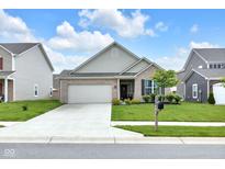 Charming single-story home featuring a well-manicured lawn and attached two-car garage at 5670 Terracotta Trce, McCordsville, IN 46055
