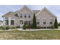 Two-story brick home with landscaped yard and large windows at 5739 Bentbrook Dr, Bargersville, IN 46106