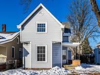 Gray house with a front porch, in the winter at 857 S Tompkins St, Shelbyville, IN 46176