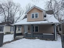Two-story house with snow-covered front yard at 3050 N Gladstone Ave, Indianapolis, IN 46218