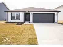 Charming home with a modern exterior, black accents, and a well-maintained lawn and driveway at 3201 W Keepsake Ln, Monrovia, IN 46157