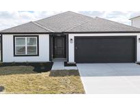 Charming single-story home features a black garage door and modern design elements at 3201 W Keepsake Ln, Monrovia, IN 46157