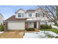 Two-story house with brown roof, attached garage, and landscaping at 7746 Cole Wood Blvd, Indianapolis, IN 46239