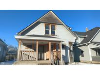 Charming two-story home with a front porch at 1052 N Mount St, Indianapolis, IN 46222