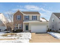 Two-story brick and beige house with a green door and attached garage at 15256 Harmon Pl, Noblesville, IN 46060