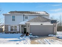 Two-story house with gray siding, attached garage, and basketball hoop at 2911 Braxton Ct, Indianapolis, IN 46229