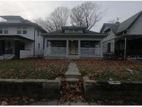 Cozy bungalow with front porch, situated on a tree-lined street at 3608 N Kenwood Ave, Indianapolis, IN 46208
