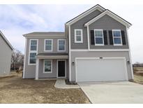 Charming two-story home showcasing a two-car garage and appealing gray siding at 3945 Highcrest Rd, Indianapolis, IN 46239
