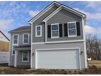 Two-story house with gray siding, white garage door, and black shutters at 3945 Highcrest Rd, Indianapolis, IN 46239