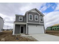 Charming two-story home with gray siding, white trim, and an attached two-car garage at 5144 Rolling Meadow Blvd, Indianapolis, IN 46237