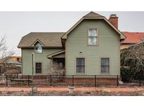 Charming two-story home boasts a classic design, complete with a well-maintained yard and inviting facade at 634 E Vermont St, Indianapolis, IN 46202