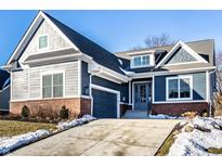 Inviting two-story home featuring a brick foundation, beautiful siding and a paved driveway at 20188 Hampton Park Dr, Westfield, IN 46074