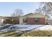 Brick ranch home with snow-covered yard at 4314 London Ct, Anderson, IN 46013
