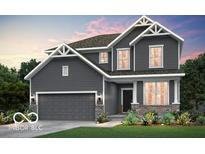Two-story house featuring gray siding, brick accents, and a two-car garage at 7184 Firestone Rd, Whitestown, IN 46052