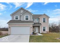 Two-story brick home with a large front yard and attached two-car garage at 1571 N Creekwater Pass, Greenfield, IN 46140