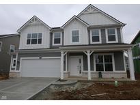 New two-story home featuring gray siding, white trim, covered porch, and an attached two-car garage at 16844 Silo Meadows Dr, Noblesville, IN 46060