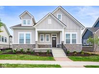 Two-story craftsman home with stone accents and a welcoming front porch at 20035 Meadow Neck Rd, Westfield, IN 46074