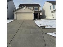Charming two-story home with attached two-car garage and concrete driveway at 2734 Mingo Ct, Indianapolis, IN 46217