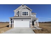 Charming two-story home with gray siding, white trim, and a spacious two-car garage at 2310 Marjorie Way, Shelbyville, IN 46176