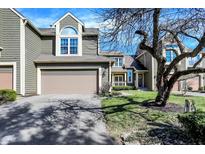 Charming townhome with two-car garage, well-manicured lawn and blue sky at 4669 Stansbury Ln, Indianapolis, IN 46254