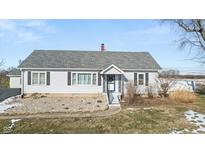 Ranch style home with gray shingle roof, white siding, and landscaping at 5920 E Neitzel Rd, Mooresville, IN 46158
