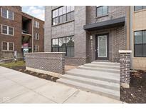 Modern brick building exterior with steps leading to the entrance at 1234 Alabama St, Indianapolis, IN 46202