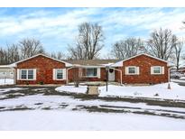 Brick ranch house with snow-covered yard at 3901 Fisher Rd, Indianapolis, IN 46239