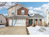 Brick two-story house with a white garage door and green front door at 6350 W Chelmsford Dr, McCordsville, IN 46055