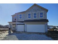 Two-story home with a two car garage is under construction with visible framing and siding at 7213 Estes Dr, Indianapolis, IN 46239
