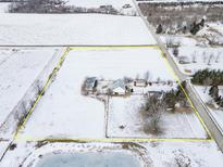 Aerial view of a rural property with house, barn, and expansive land at 18531 Durbin Rd, Noblesville, IN 46060