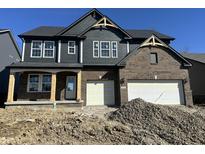 New construction two story home featuring a two car garage and covered front porch at 19983 Boulder Brook Ln, Westfield, IN 46074